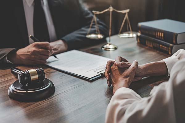 Legal team speaking with a client