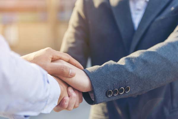 Attorney shaking hands with a client